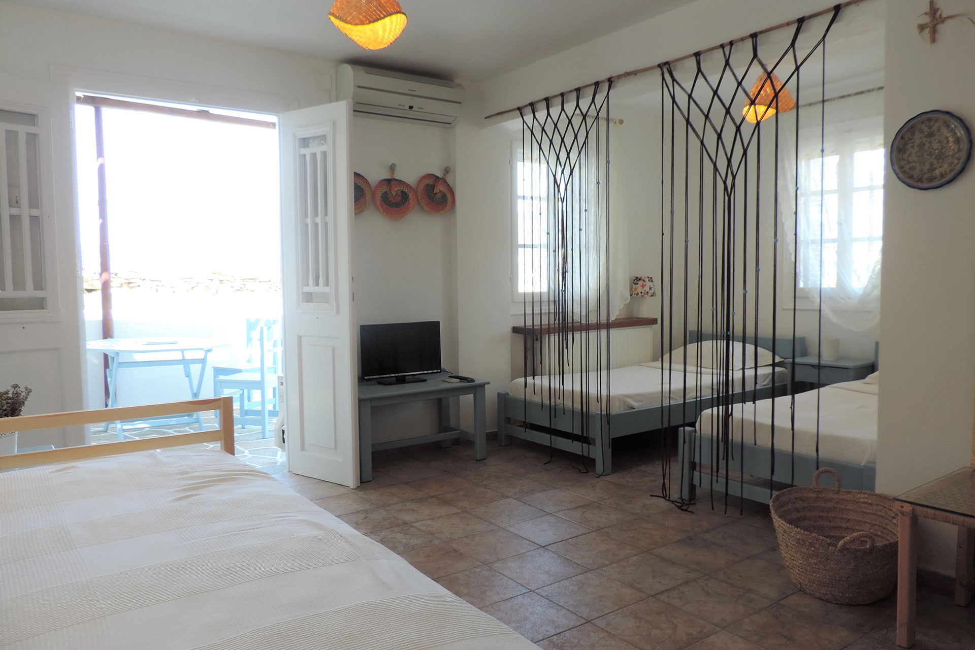 Bedroom with single beds at Ambeli family house at Sifnos