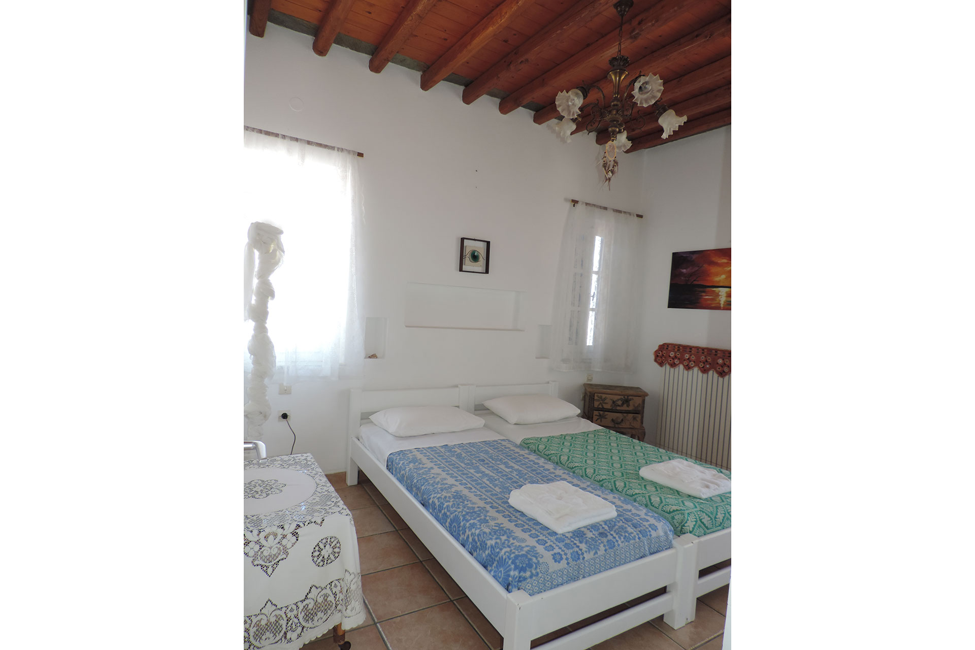Bedroom with single beds at Elia family house at Kavos