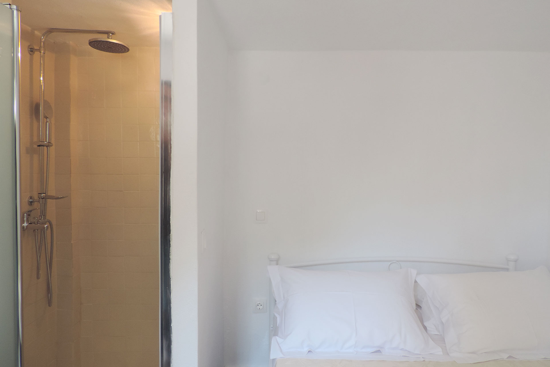 The bedroom and the bathroom of Elia family house at Kavos